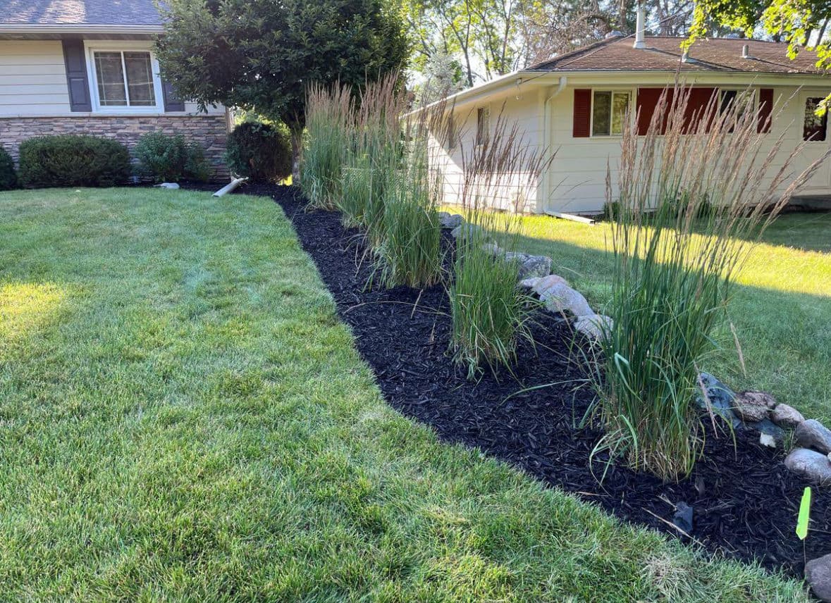 Fresh Mulch, Natural Edging, and New Plants Done Right image