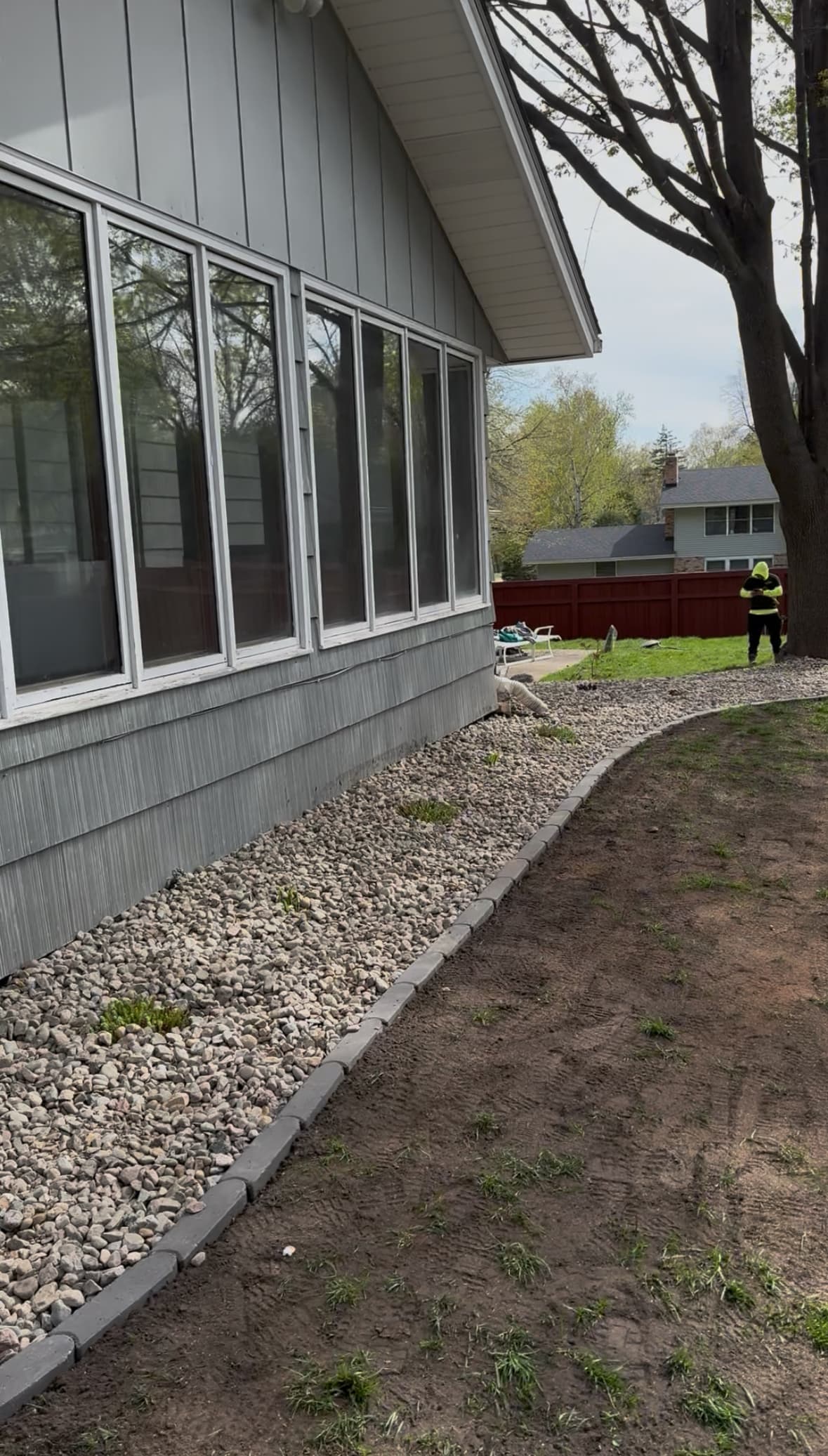 Rock Border and Paver Edging Along a Home Foundation image